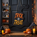 Trick or Treat laser cut wood witch hat sign in Halloween decorated entryway